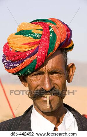 Stock Image - Rajasthani Camel Seller. Pushkar camel fair. Pushkar. Rajasthan. India.. Fotosearch