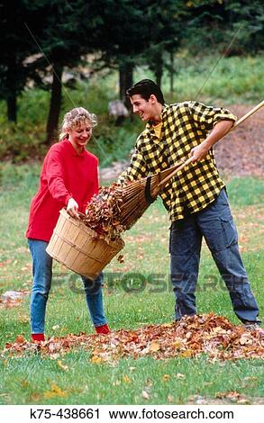 Raking leaves together View Large Photo Image Stock Image - Raking leaves together. Fotosearch