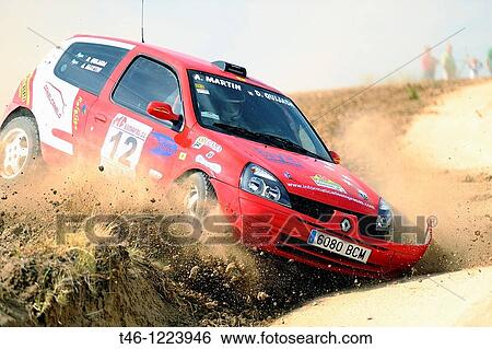 Rally car exiting the track of land in Madrid View Large Photo Image Stock Photograph - Rally car exiting the track of land in Madrid. Fotosearch