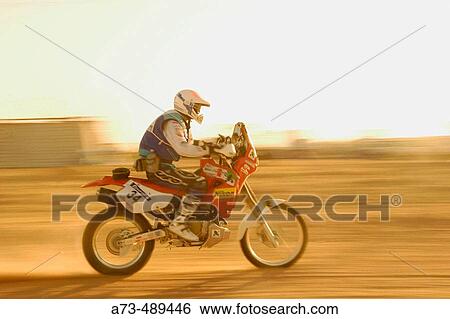 Rally des Pharaons 2003. Massimo Magni (Honda) starting for stage 2 Baharija Camp. Sahara. Western Desert. Egypt. View Large Photo Image Stock Photograph - Rally des Pharaons 2003. Massimo Magni (Honda) starting for stage 2 Baharija Camp. Sahara. Western Desert. Egypt.. Fotosearch