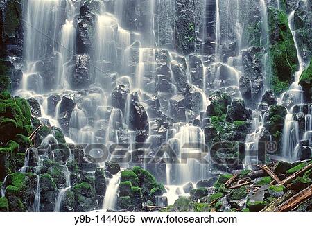 Stock Photograph - Ramona Falls is formed by a small creek tumbling over a mossy cliff of columnar basalt, Mt Hood Wilderness, Mt Hood National Forest, Oregon, USA. Fotosearch