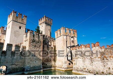 Ramparts of Scaliger Castle (13th century), Sirmione, Lake Garda, Brescia province, Lombardy, Italy. View Large Photo Image Stock Image - Ramparts of Scaliger Castle (13th century), Sirmione, Lake Garda, Brescia province, Lombardy, Italy.. Fotosearch