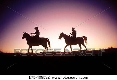Rancher couple on horseback View Large Photo Image Stock Image - Rancher couple on horseback. Fotosearch