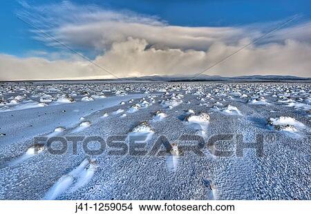 Rangipo desert dawn panorama after snow storm, cloud-covered Mt Ruapehu beyond, Tongariro National Park, New Zealaand. View Large Photo Image Picture - Rangipo desert dawn panorama after snow storm, cloud-covered Mt Ruapehu beyond, Tongariro National Park, New Zealaand.. Fotosearch