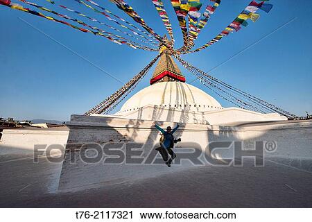 Raquel practicing her vertical jump at the Boudhanath Stupa in Kathmandu, Nepal. View Large Photo Image Stock Image - Raquel practicing her vertical jump at the Boudhanath Stupa in Kathmandu, Nepal.. Fotosearch