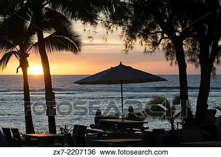Rarotonga Island. Cook Island. Polynesia. South Pacific Ocean. Sunset on the beach in Hotel Crown Beach Resort & Spa. Lit. Tourists taking photos. View Large Photo Image Stock Photograph - Rarotonga Island. Cook Island. Polynesia. South Pacific Ocean. Sunset on the beach in Hotel Crown Beach Resort & Spa. Lit. Tourists taking photos.. Fotosearch
