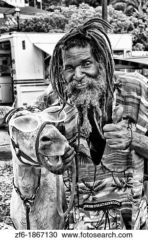 Rasta man in dress in St Thomas in US Virgin Islands View Large Photo Image Stock Image - Rasta man in dress in St Thomas in US Virgin Islands. Fotosearch