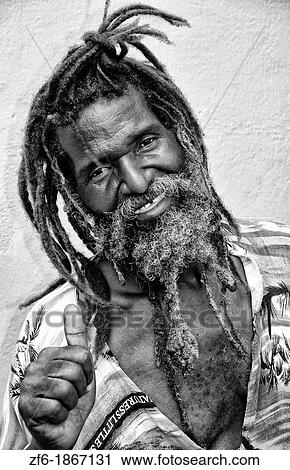 Rasta man in dress in St Thomas in US Virgin Islands View Large Photo Image Stock Image - Rasta man in dress in St Thomas in US Virgin Islands. Fotosearch
