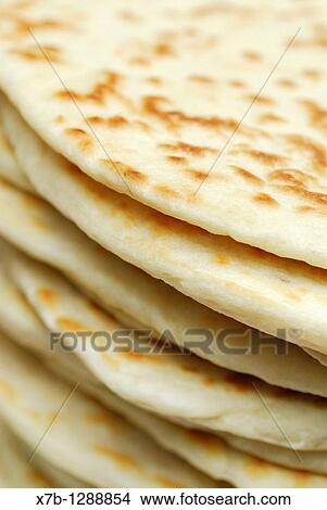 Ravenna Italy Stack of freshly made piadine, traditional flat bread from Emilia Romagna View Large Photo Image Picture - Ravenna Italy Stack of freshly made piadine, traditional flat bread from Emilia Romagna. Fotosearch