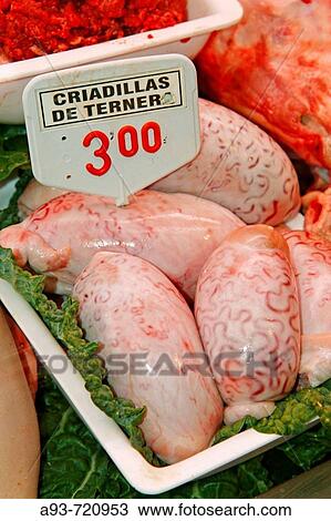Stock Image - Raw bovine testicles in La Boqueria market, Barcelona. Catalonia, Spain. Fotosearch