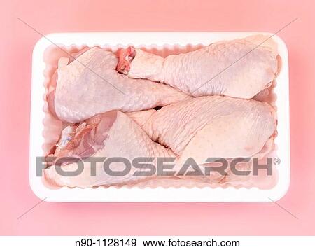 Raw chicken drumsticks on a kitchen bench View Large Photo Image Stock Photo - Raw chicken drumsticks on a kitchen bench. Fotosearch