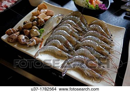 Raw prawns, fish and snails for barbecue. Image taken at Taipei, Taiwan. View Large Photo Image Picture - Raw prawns, fish and snails for barbecue. Image taken at Taipei, Taiwan.. Fotosearch