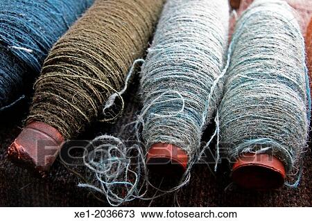 Stock Image - Raw woolen clews, Museum, Isle of Skye, Highland, Scotland, UK. Fotosearch