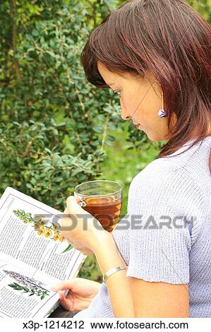 Stock Image - Reading a book. Fotosearch