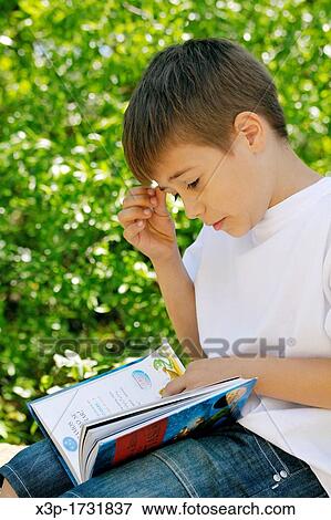 Stock Photo - Reading a book. Fotosearch
