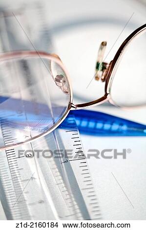 reading glasses, ruler and pen. View Large Photo Image Picture - reading glasses, ruler and pen.. Fotosearch