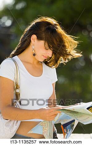 Reading map on a windy day View Large Photo Image Stock Photo - Reading map on a windy day. Fotosearch
