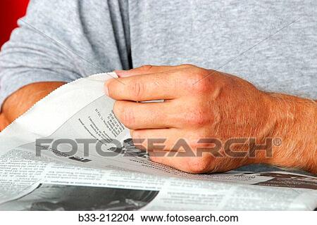 Picture - Reading newspaper. Fotosearch