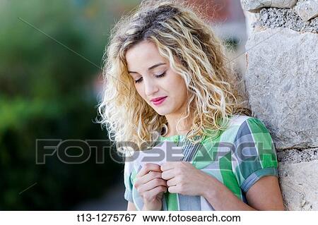 Stock Photo - Reading paper note student girl. Fotosearch