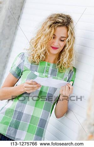 Reading paper note student girl View Large Photo Image Stock Photograph - Reading paper note student girl. Fotosearch