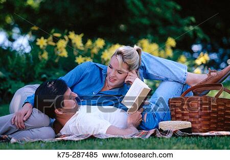 Stock Photography - Reading romantic prose or poetry to his love. Fotosearch