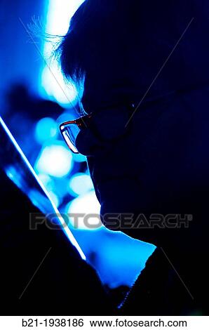 Reading with glasses View Large Photo Image Stock Photograph - Reading with glasses. Fotosearch