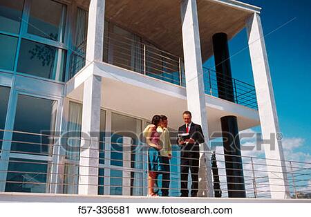 Real estate. Couple and contractor View Large Photo Image Stock Image - Real estate. Couple and contractor. Fotosearch