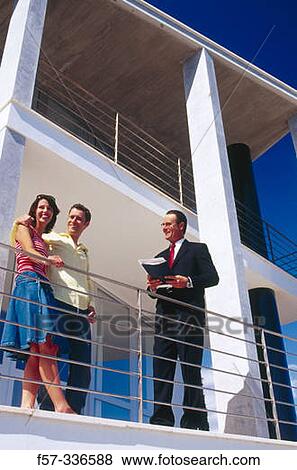 Stock Photo - Real estate. Couple and contractor. Fotosearch