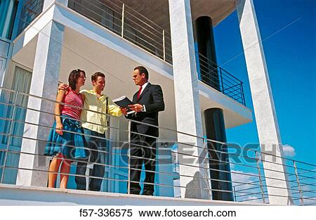 Stock Photography - Real estate. Couple and contractor. Fotosearch