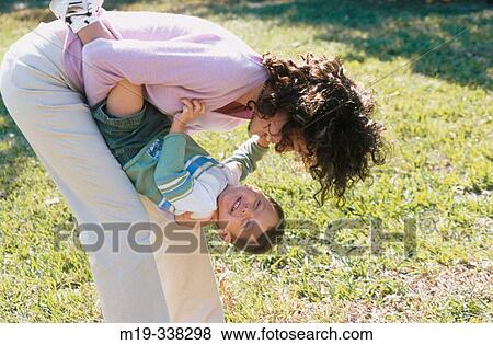 Real mother and son playing View Large Photo Image Stock Photo - Real mother and son playing. Fotosearch