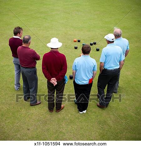Rear view of 6 men playing lawn bowls, Aberystwyth Wales UK View Large Photo Image Picture - Rear view of 6 men playing lawn bowls, Aberystwyth Wales UK. Fotosearch