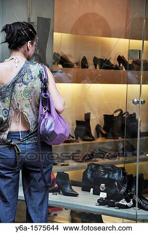 Rear view of a woman looking in shoe store window, Palma De Mallorca, Spain, Europe View Large Photo Image Picture - Rear view of a woman looking in shoe store window, Palma De Mallorca, Spain, Europe. Fotosearch