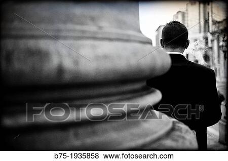 Rear view of executive out of the old Stock Exchange building in London, England, UK View Large Photo Image Stock Photo - Rear view of executive out of the old Stock Exchange building in London, England, UK. Fotosearch