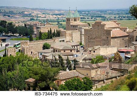 Rear view of Puerta Nueva de Bisagra town gate and Church of Santiago del Arrabal (13th century), Toledo. Castilla-La Mancha, Spain View Large Photo Image Stock Photography - Rear view of Puerta Nueva de Bisagra town gate and Church of Santiago del Arrabal (13th century), Toledo. Castilla-La Mancha, Spain. Fotosearch