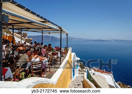 Reataurant With Views, Oia, Santorini, Greek Islands, Greece. View Large Photo Image Stock Photography - Reataurant With Views, Oia, Santorini, Greek Islands, Greece.. Fotosearch