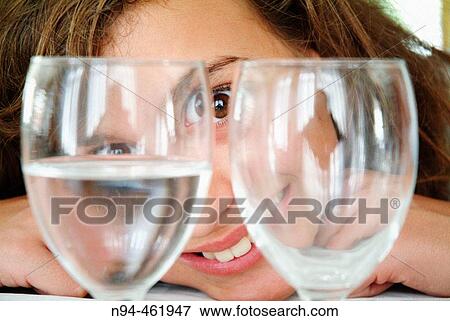 Rebeca looking through two glasses empty restaurant Don Baco La Caada, Valencia, Valencia, Spain. View Large Photo Image Stock Photo - Rebeca looking through two glasses empty restaurant Don Baco La Caada, Valencia, Valencia, Spain.. Fotosearch