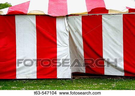 Picture - red and white striped circus tent. Fotosearch