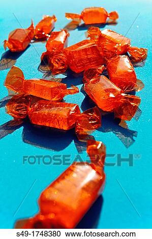 Red candies on a blue blackground View Large Photo Image Stock Image - Red candies on a blue blackground. Fotosearch