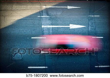 Stock Image - red car on road,. Fotosearch