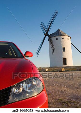 Red car, Windmills, Campo de Criptana, Ciudad Real province, Ruta de Don Quijote, Castilla-La Mancha, Spain, Europe View Large Photo Image Stock Photo - Red car, Windmills, Campo de Criptana, Ciudad Real province, Ruta de Don Quijote, Castilla-La Mancha, Spain, Europe. Fotosearch