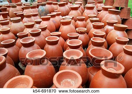 Red clay pots placed in line for sale, Pune, India View Large Photo Image Stock Image - Red clay pots placed in line for sale, Pune, India. Fotosearch