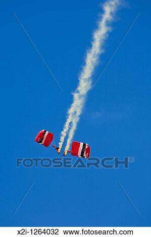 Red Devils Parachute Regiment Freefall Team performsa at air show at NAS Jacksonville, Florida View Large Photo Image Stock Image - Red Devils Parachute Regiment Freefall Team performsa at air show at NAS Jacksonville, Florida. Fotosearch