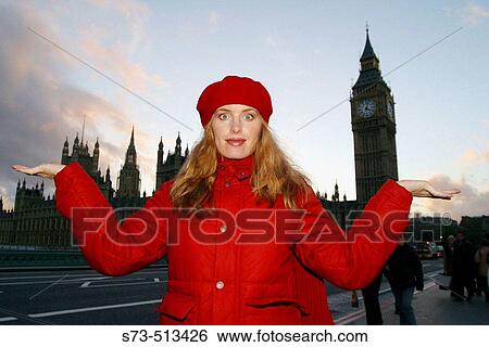 Red dressed young woman in front of Houses of Parliament, London. England, UK View Large Photo Image Stock Photograph - Red dressed young woman in front of Houses of Parliament, London. England, UK. Fotosearch