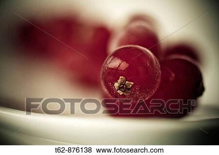 Red fruit on a plate View Large Photo Image Stock Photo - Red fruit on a plate. Fotosearch
