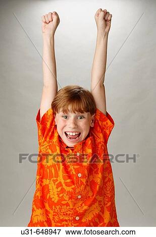 Red haired boy lifting his arms View Large Photo Image Stock Photo - Red haired boy lifting his arms. Fotosearch