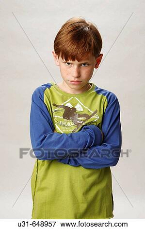 Red haired boy looking mad at the camera View Large Photo Image Stock Photo - Red haired boy looking mad at the camera. Fotosearch