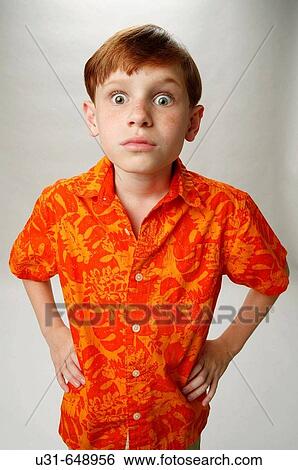 Red haired boy looking surprised at the camera View Large Photo Image Stock Photograph - Red haired boy looking surprised at the camera. Fotosearch