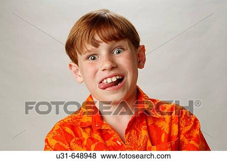Red haired boy sticks his tongue out View Large Photo Image Stock Photo - Red haired boy sticks his tongue out. Fotosearch