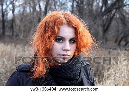 Picture - red haired girl outdoors. Fotosearch