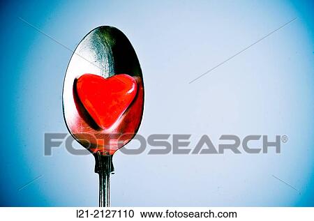 Red heart in a metal spoon View Large Photo Image Stock Image - Red heart in a metal spoon. Fotosearch